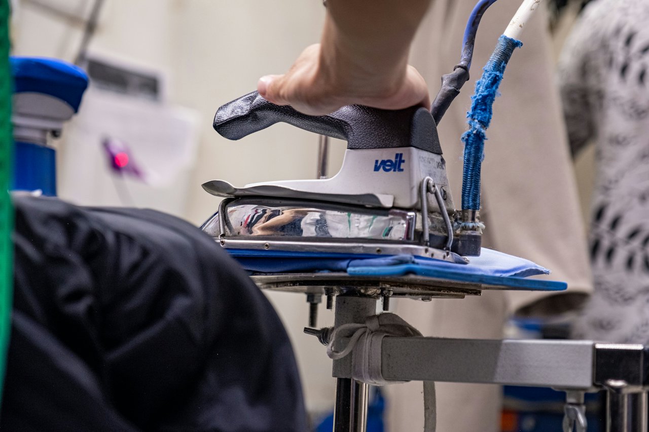 Professional heat press applying a transfer