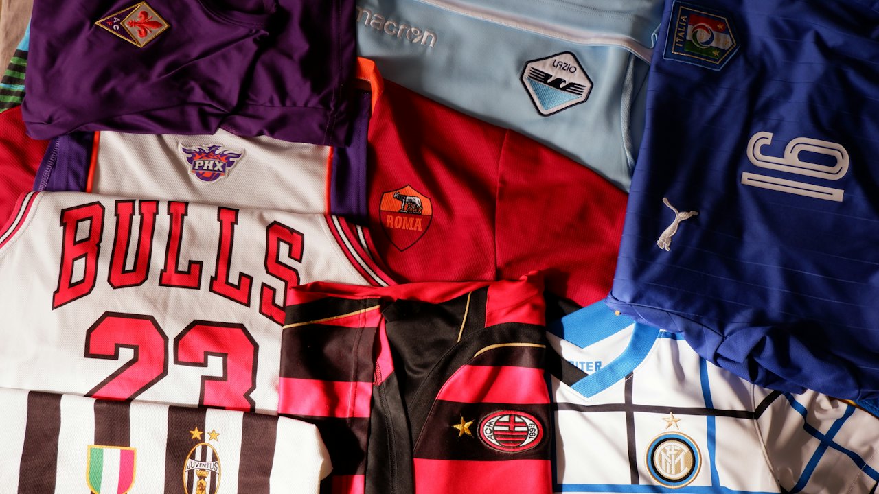 Pile of football and basketball jerseys