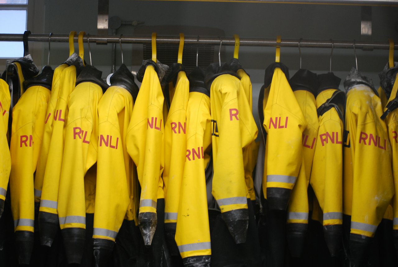 Yellow high-visibility jackets with reflective stripes